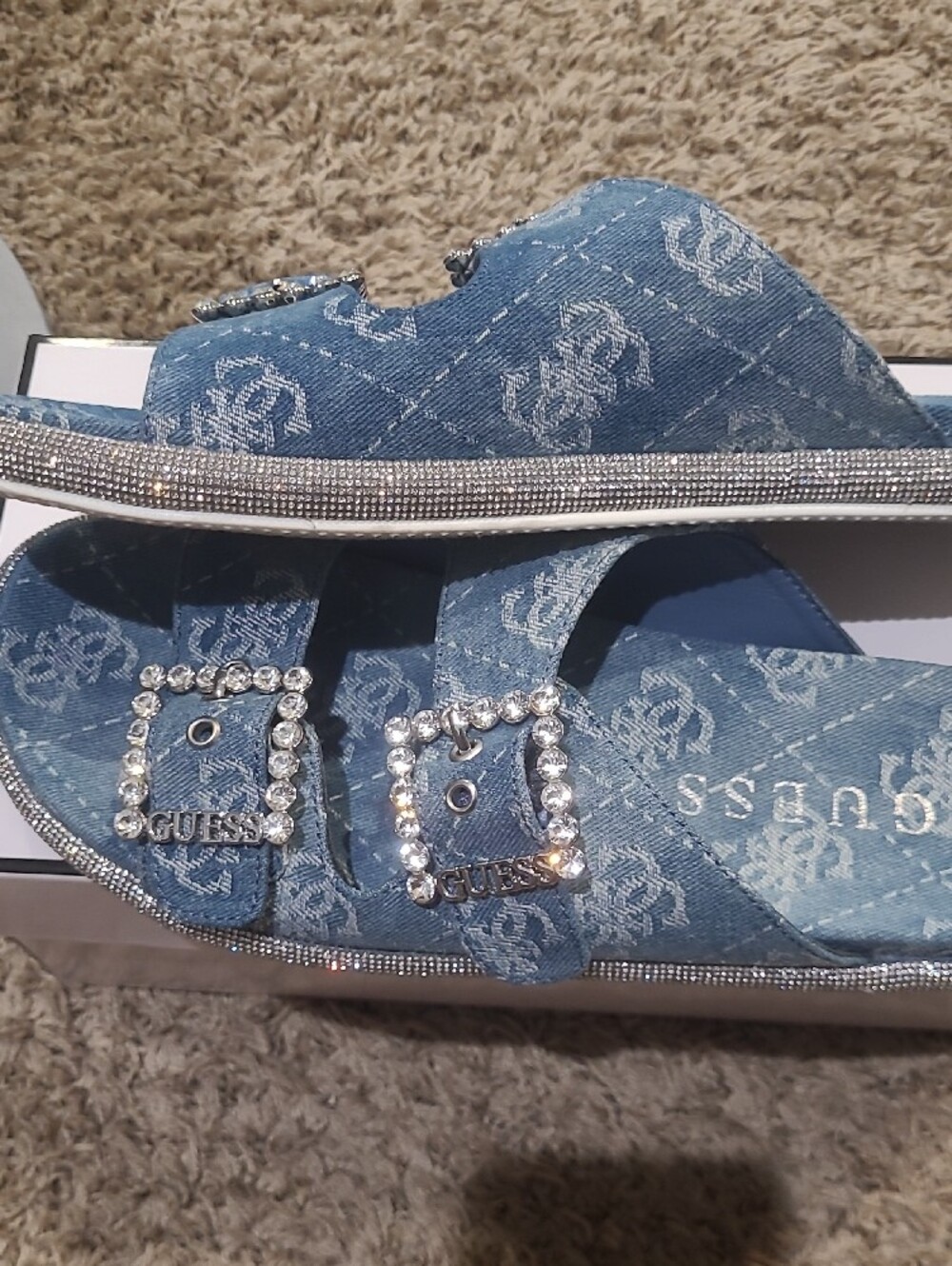 GUESS Denim Logo Slide Sandals in Light Blue with Rhinestone Buckles.